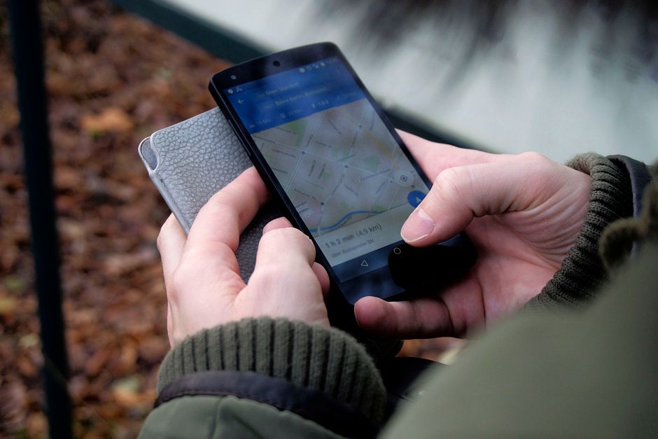 A person checking directions on a map app on their phone