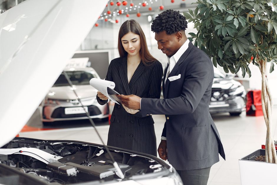 Customers reviewing vehicle details
