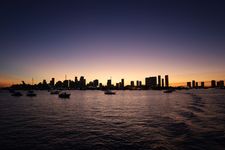 Miami skyline at sunset seen across the water
