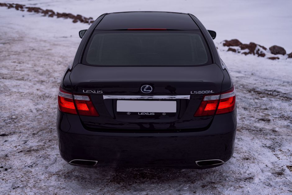 A luxury sedan on a snowy road
